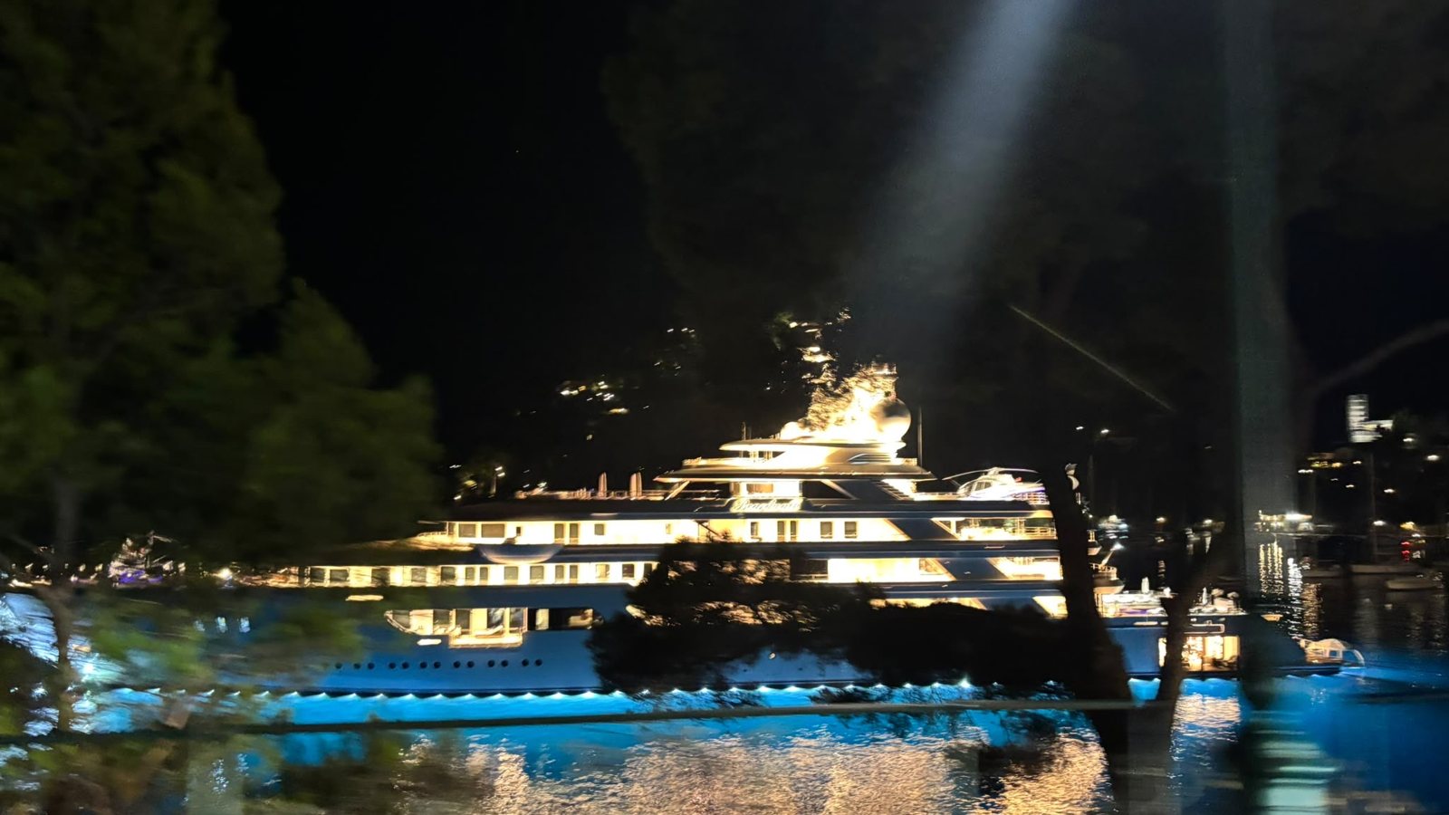 Superyacht lit up in the harbour of Portofino at night