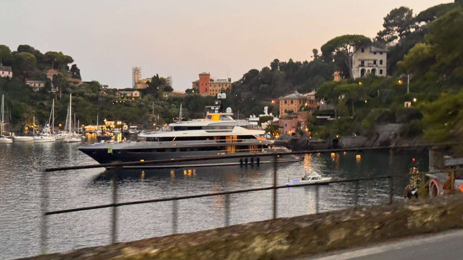 Superyacht in the harbour of Portofino at dusk